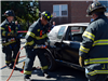 Firefighters Sawing Hole in a Car