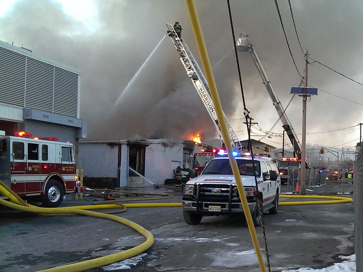 Firefighters Work to Extinguish Structure Fire